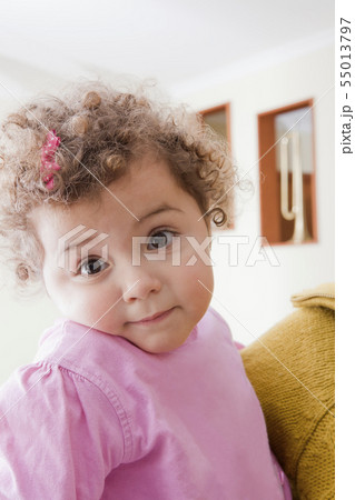 Girl with curly brown hair 55013797