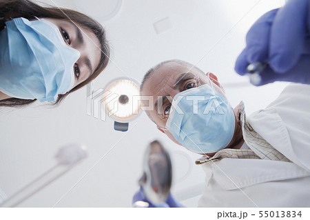 View directly below dental hygienist and dentist during examination View directly below dental hygienist and dentist during examination 55013834
