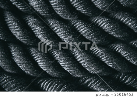 Close up of black battle rope for functional training. Sport and fitness equipment. Close up of black battle rope for functional training. Sport and fitness equipment. 55016452