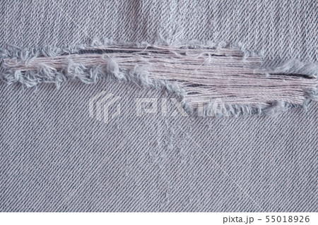 Pattern of tear and old on denim trousers. Pattern of tear and old on denim trousers. 55018926