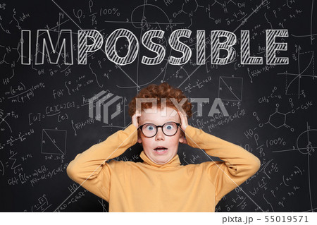 Scared kid wearing glasses with text Impossible Scared kid wearing glasses with text Impossible 55019571