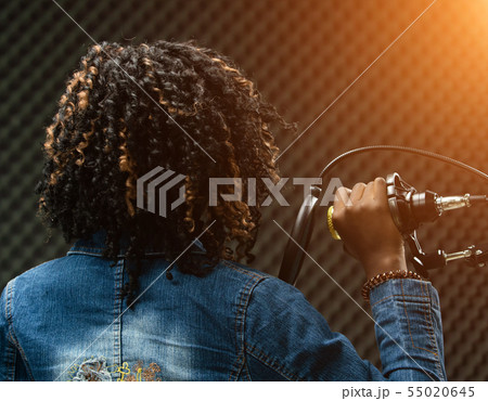 African Teenager Woman Afro hair sing a song African Teenager Woman Afro hair sing a song 55020645