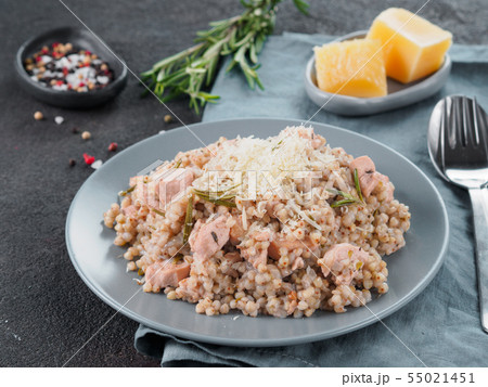 Raw buckwheat risotto with chicken meat and rosemary Raw buckwheat risotto with chicken meat and rosemary 55021451