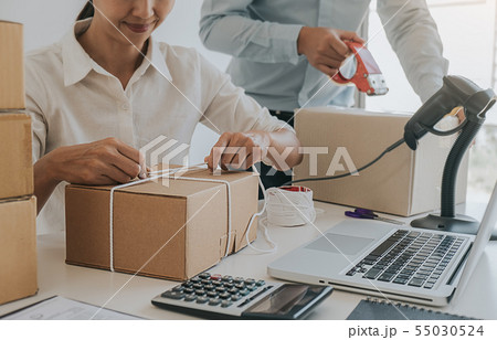 Online shopping concept. Young women receive 55030524