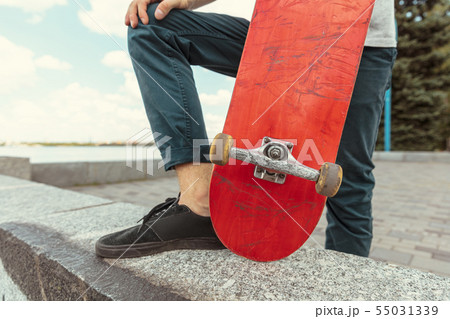 Skateboarder at the city's street in sunny day 55031339