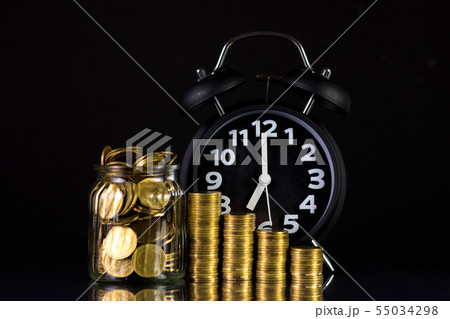 Coins stacks with coin in glass jar bottle and Coins stacks with coin in glass jar bottle and 55034298