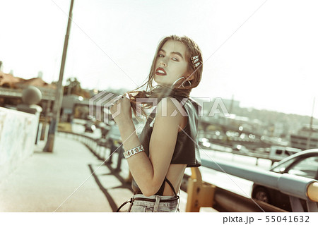 Attractive young woman having bunch of silver accessories 55041632