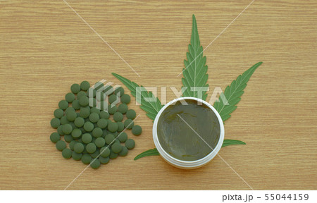 Cream cannabis and tablets medical capsules or pills hemp and leaf cannabidiol CBD harvested dried 55044159