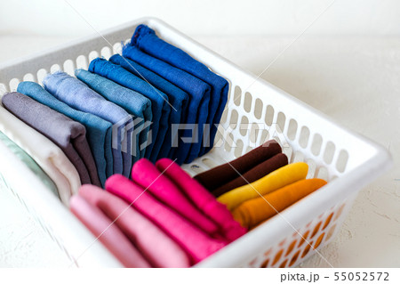 Keeping clothes at the box on white background 55052572