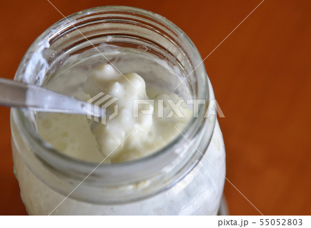 A teaspoon stirs the kefir and raises some 55052803
