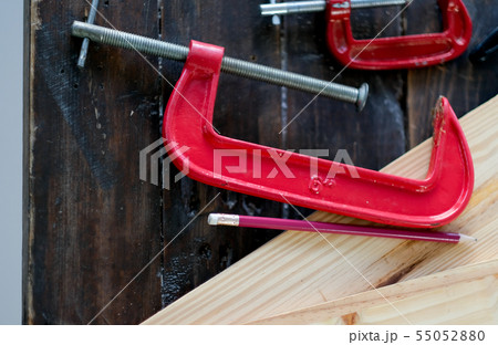 Close up view of red clamp tool for wood crafting 55052880