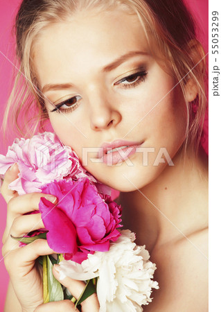 young beauty woman with flower peony pink closeup makeup soft tender gentle look young beauty woman with flower peony pink closeup makeup soft tender gentle look 55053299