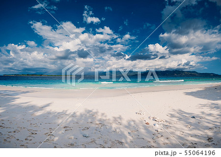Paradise beach with blue ocean in tropical island 55064196
