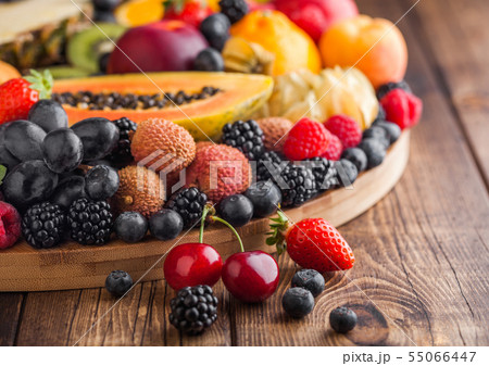 Fresh raw organic summer berries and exotic fruits Fresh raw organic summer berries and exotic fruits 55066447