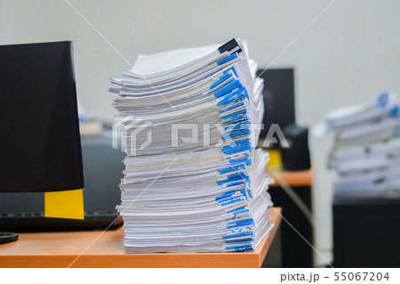 Heap of papers work stack documents on office desk ,business documents billing and examination to Heap of papers work stack documents on office desk ,business documents billing and examination to 55067204