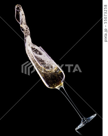 Glass for champagne with bubbles and splashes isolated on black background. Glass for champagne with bubbles and splashes isolated on black background. 55073258