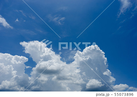 white fluffy clouds in the blue sky 55073896