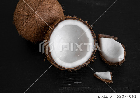 Close-Up Of Coconut milk Against Black background 55074061