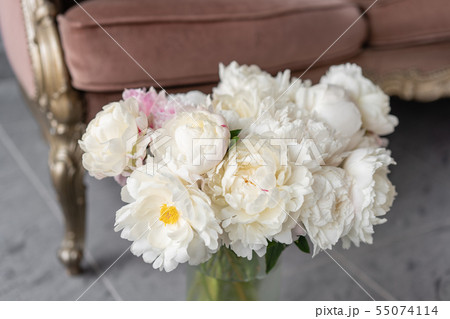 White peonies in a metal vase. Beautiful peony flower for catalog or online store. Floral shop 55074114