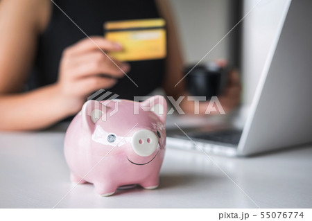 Close up of piggy bank, Business woman consumer Close up of piggy bank, Business woman consumer 55076774