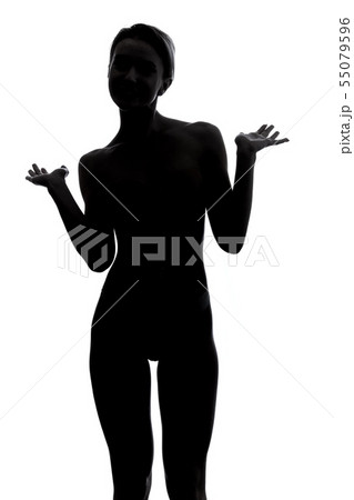 silhouette of hesitated girl shrugging her shoulder and looking at the camera 55079596