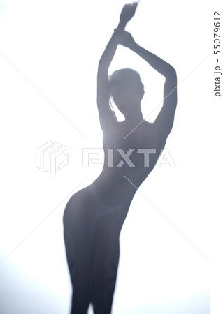 Sexy and beautiful dancer woman with raised arms 55079612