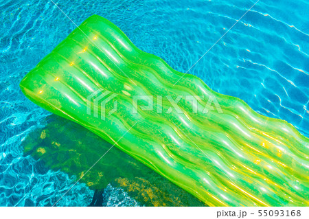 Colorful swim ring or rubber float around swimming pool water Colorful swim ring or rubber float around swimming pool water 55093168