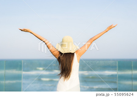 Portrait beautiful young asian woman happy and smile on the beach sea and ocean 55095624