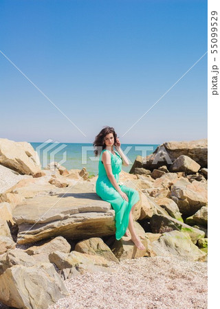 Young girl on summer beach with shell Young girl on summer beach with shell 55099529