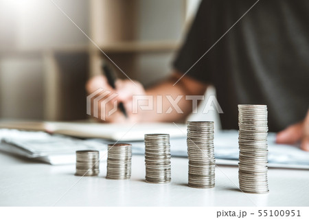 Man using calculator Accounting Calculating Cost Man using calculator Accounting Calculating Cost 55100951