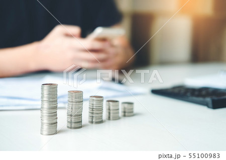 Man using calculator Accounting Calculating Cost Man using calculator Accounting Calculating Cost 55100983