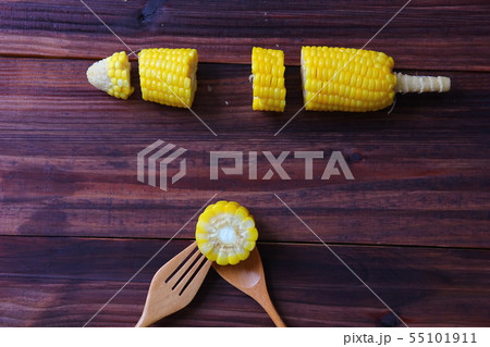 pieces of corn instant cooking with wooden spoon . 55101911