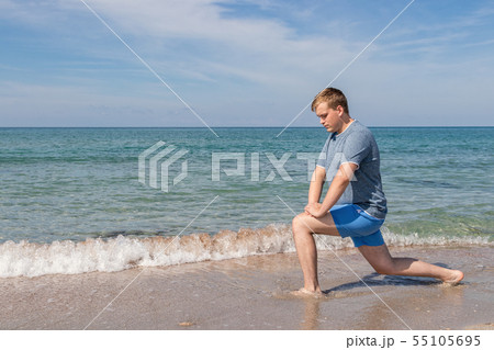 Handsome Man Exercising At Beach, Training Outdoor Handsome Man Exercising At Beach, Training Outdoor 55105695