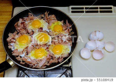 Fried eggs with bacon in a pan Fried eggs with bacon in a pan 55108419