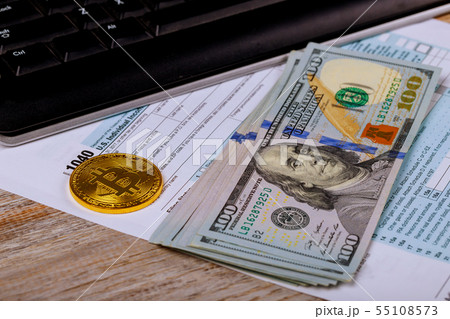 Tax papers in an envelope with 100 dollar bills 55108573