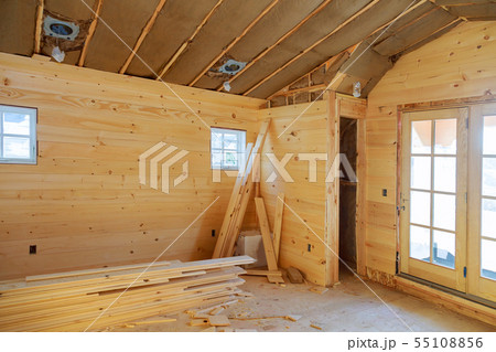 Empty room in a new wooden house under 55108856