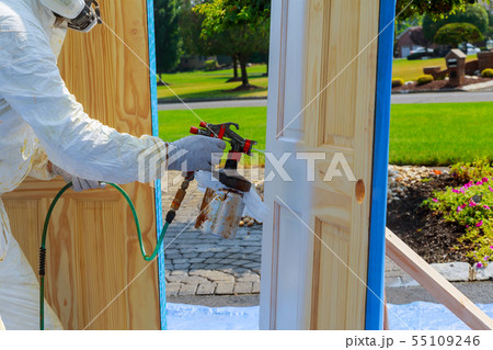 Master painting wood doors with spray gun Master painting wood doors with spray gun 55109246