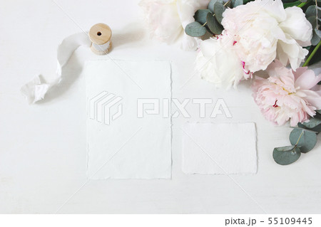 Feminine wedding, birthday table composition with floral bouquet. White and pink peonies flowers 55109445