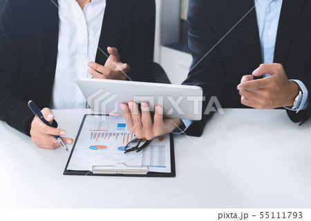 Business executives adviser using digital tablet  55111793