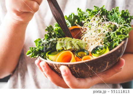 Healthy vegan lunch in a coconut bowl.  55111813
