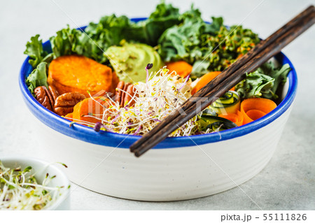 Healthy vegan lunch in white bowl. Buddha bowl Healthy vegan lunch in white bowl. Buddha bowl 55111826