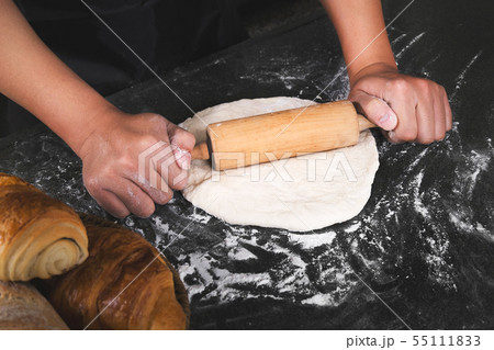 close up of man chef cooking processing dough 55111833
