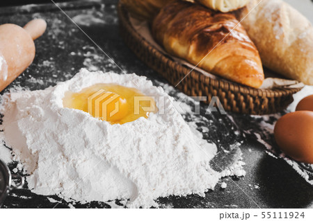 Dough preparation with eggs, flour and bread on a Dough preparation with eggs, flour and bread on a 55111924