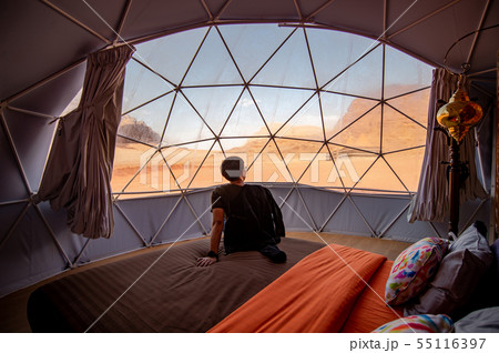 Tourist man in dome tent at Wadi Rum, Jordan Tourist man in dome tent at Wadi Rum, Jordan 55116397