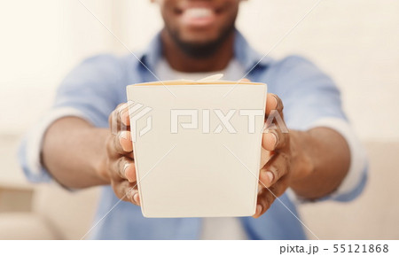 Man enjoying chinese fast food in delivery box Man enjoying chinese fast food in delivery box 55121868