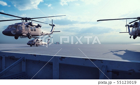 Military helicopters Blackhawk take off from an aircraft carrier at clear day in the endless blue Military helicopters Blackhawk take off from an aircraft carrier at clear day in the endless blue 55123019