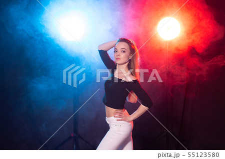 Young woman dancing in the dark, emotions and enjoyment Young woman dancing in the dark, emotions and enjoyment 55123580