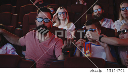 Parents covering theirs childrens eyes in cinema Parents covering theirs childrens eyes in cinema 55124701