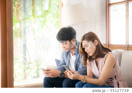 Young asian couple with problem touch phone 55127739