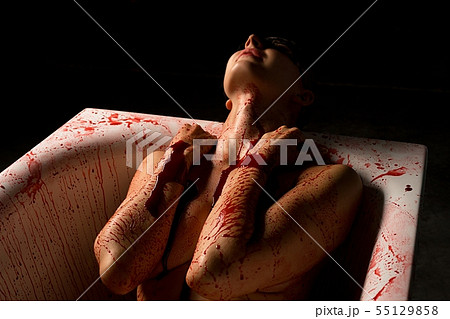 Nude woman bleeding in bath shot 55129858